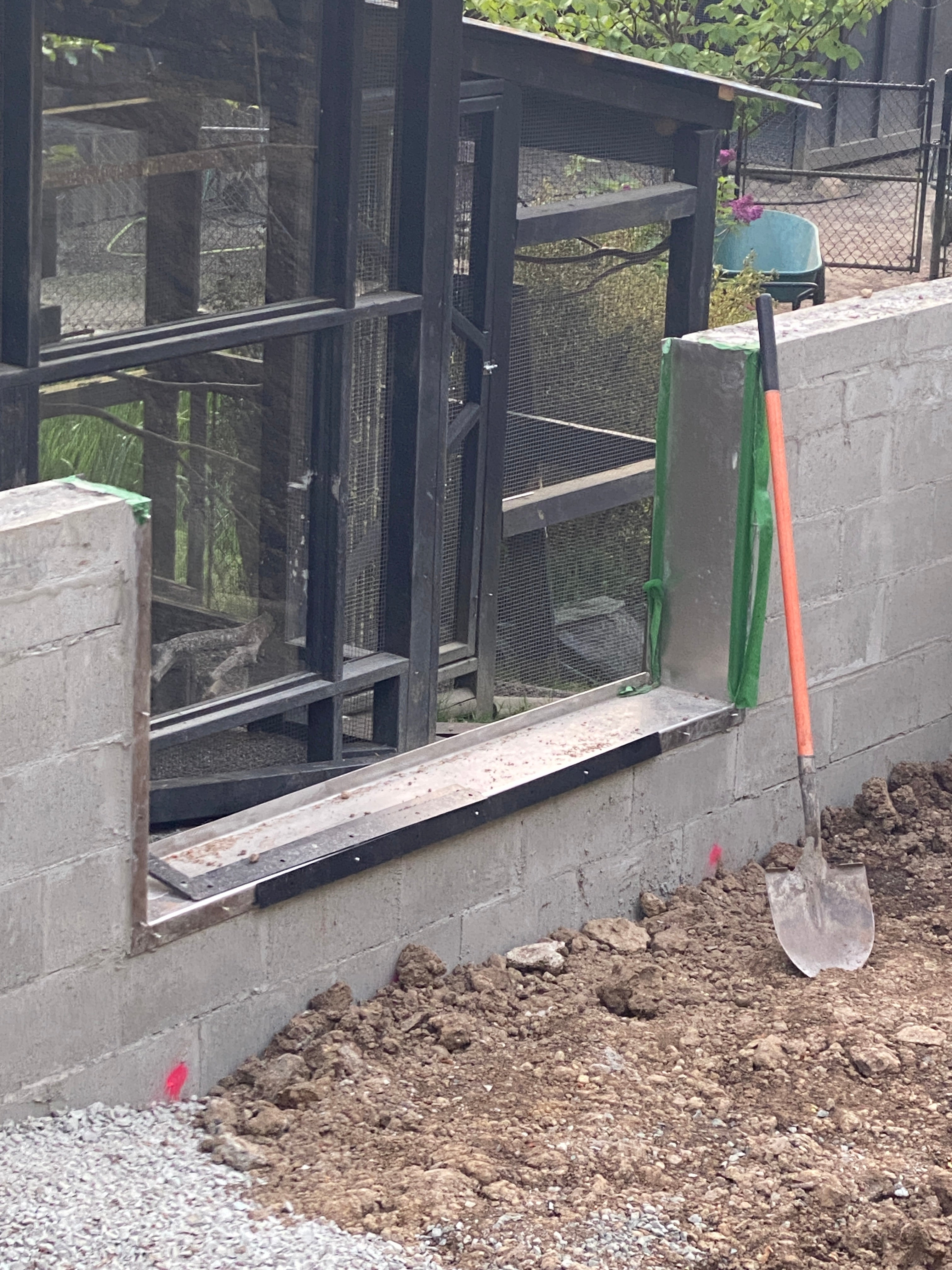 Customer photo: pond wall and custom Pond Portals window mid-build