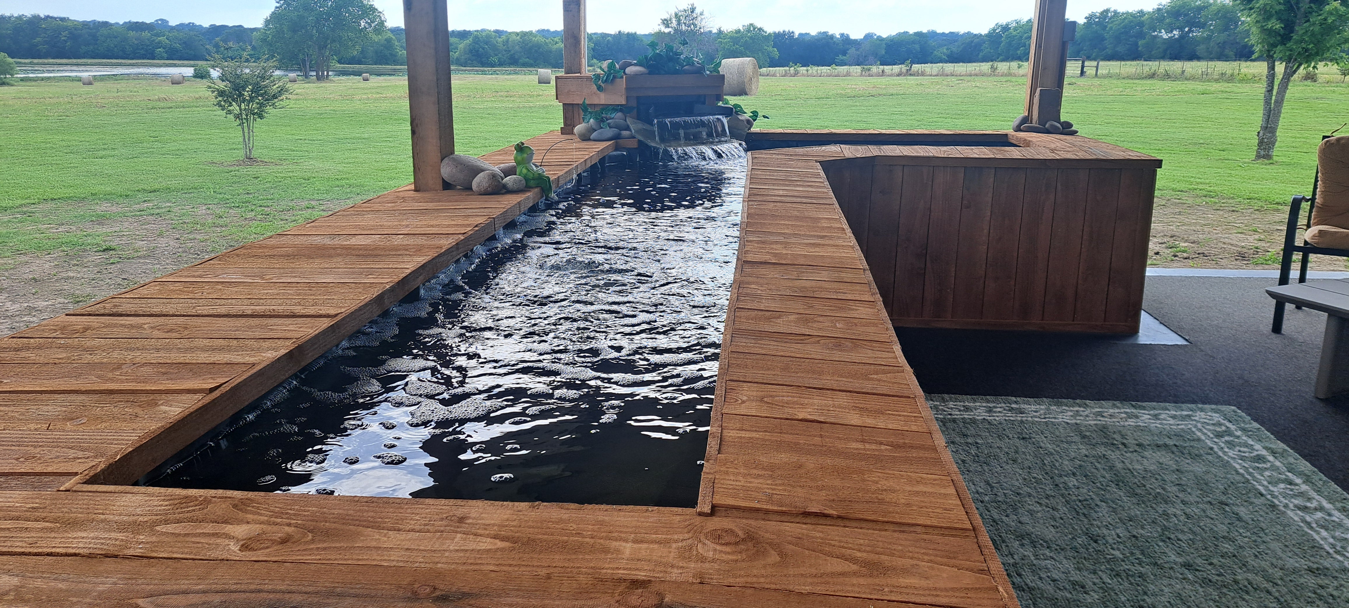 Customer photo: finished koi pond with a Pond Portals viewing window
