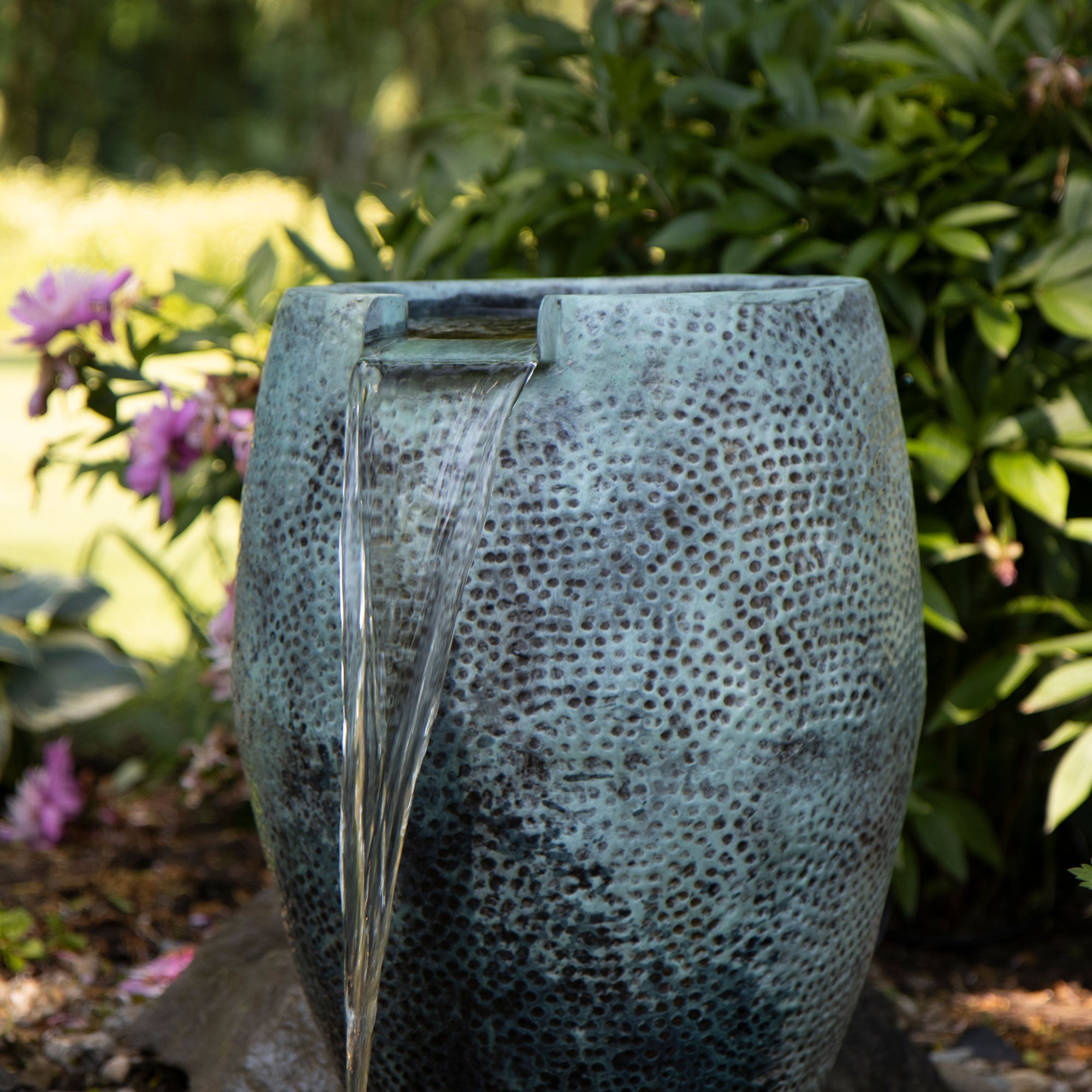 Aura Vase with spillway — installed garden view